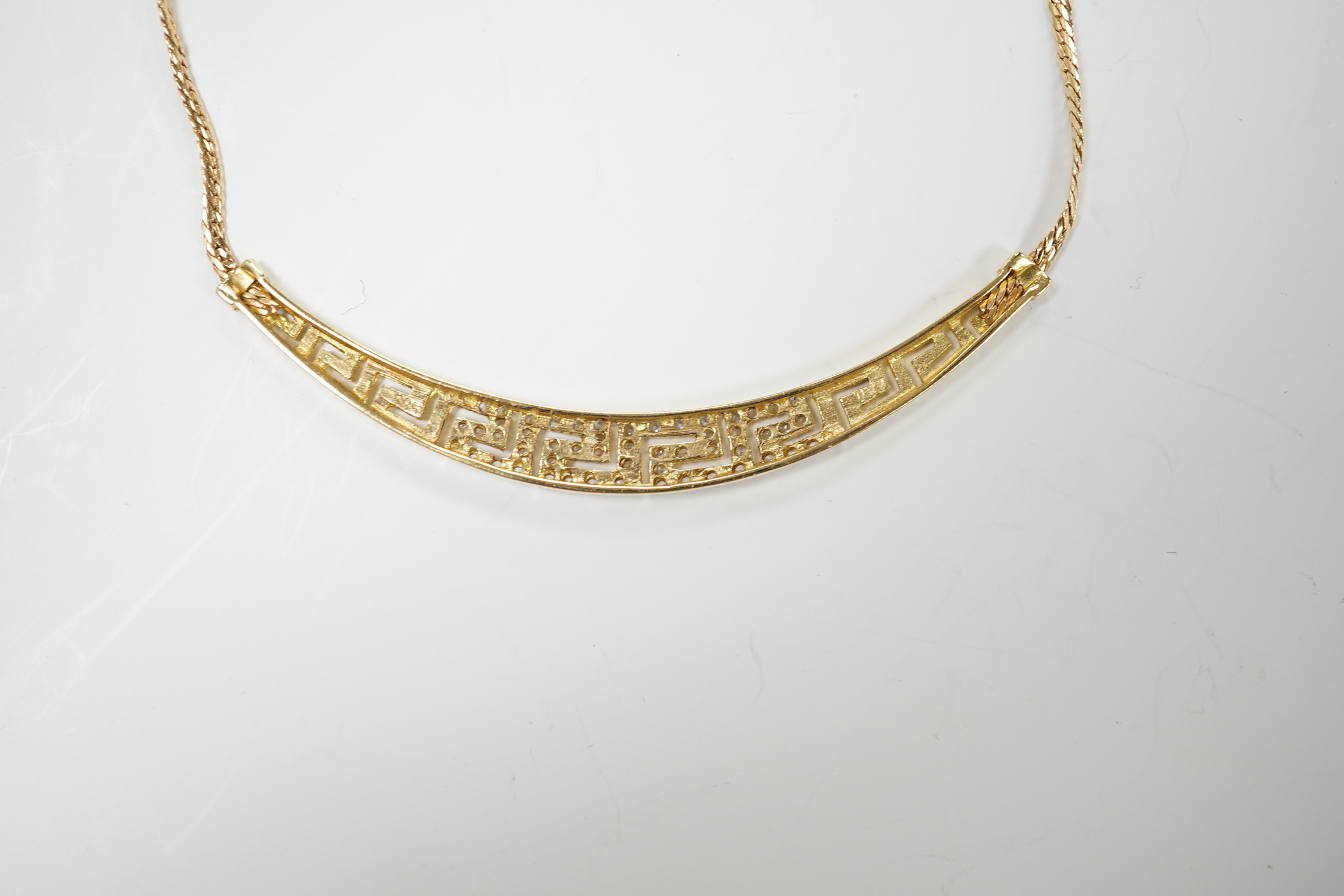 A modern 585 yellow metal and simulated diamond cluster set necklace, 40cm, gross weight 8.1 grams.